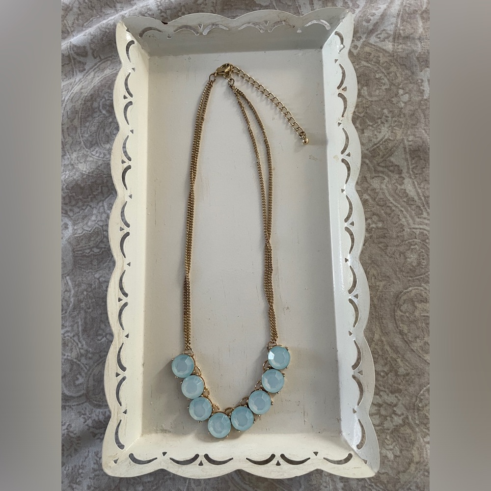 16” necklace with the prettiest light blue stones.  Gold chain has extender
